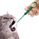 QIYADIN cat-pill-shooter soft-tip in use for gentle pill administration.