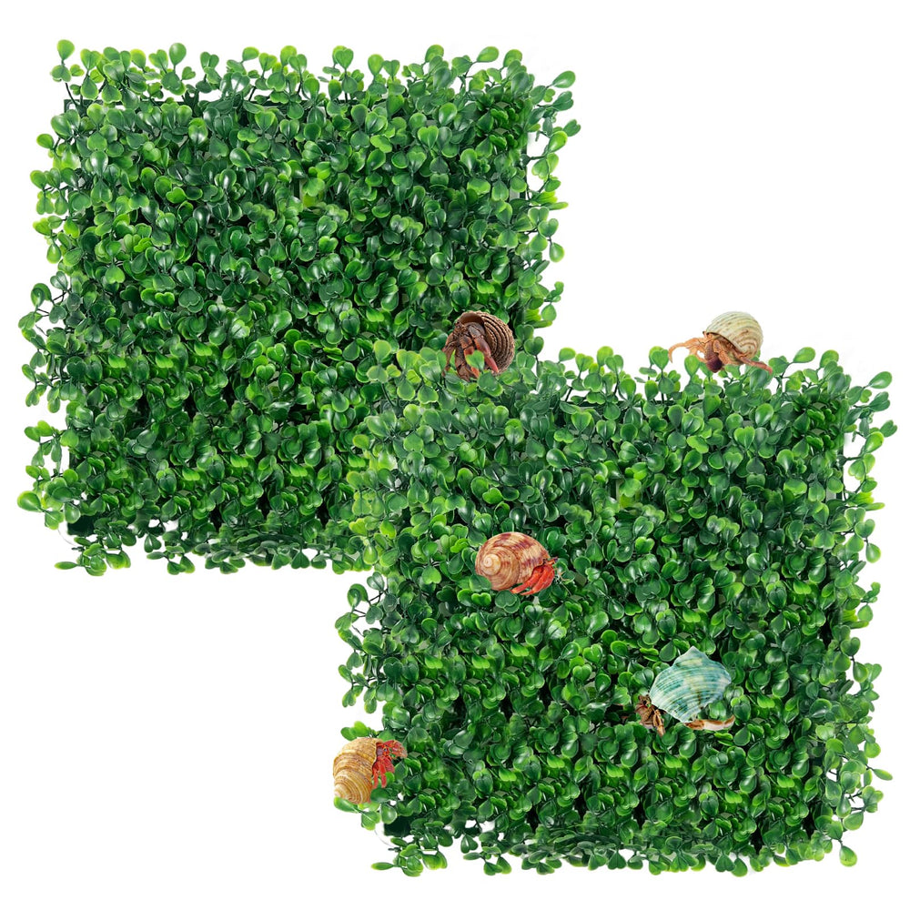 Rainmae faux grass mat with suction cups secures to tank bottom for stable decoration.