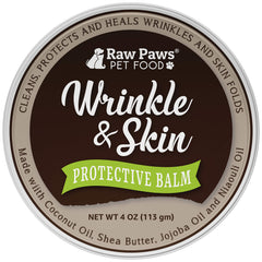 Raw Paws wrinkle and skin balm application on dog face demonstrates soothing care for sensitive skin.