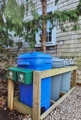 Recycling Rules small hanging wastebasket in the garden for tidy waste management.