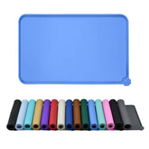 Reopet waterproof pet feeding mat with raised edges contains spills during meals.