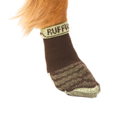 Ruffwear Bark'n Boot Socks in earth brown on a paw showing comfortable boot fit.