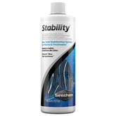 Seachem Stability bottle-cap close-up shows precise dosing for new tank setups.
