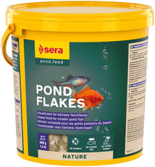 Sera pond flakes bottle side view for convenient year-round pond feeding.