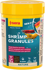 Sera Shrimp Granules pouring—tiny sinking bits designed for natural grazing and growth