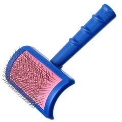 Show Tech Tuffer Than Tangles Slicker Brush in hand with ergonomic grip for comfortable grooming