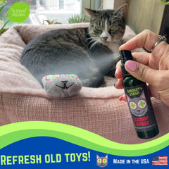 Smokey's Stash catnip spray being applied to a toy for rejuvenation.