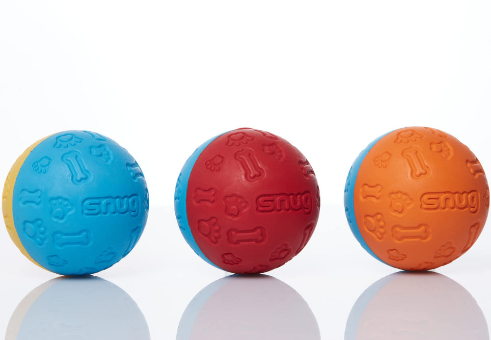 Pelotas Snug de colores brillantes, resistentes para mordidos moderados durante el juego.