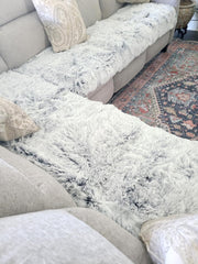 Snugglesinto washable pet pad close-up indicates easy care on gentle cycles.