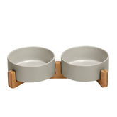 SPUNKYJUNKY ceramic bowl with wood stand – top view shows organized feeding for pets.