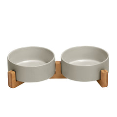SPUNKYJUNKY ceramic bowl with wood stand – top view shows organized feeding for pets.
