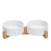 SPUNKYJUNKY ceramic dog bowl with wood stand and non-slip base for stable mealtimes.