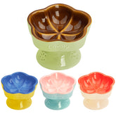 S&Q'S CERAMICS raised cat bowl with petal design supports comfortable feeding.