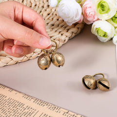 Styquenzer brass dog bell packaging shows four-pack convenience.