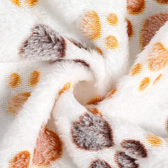 Tegeme cozy blanket draped over a pet bed illustrating warmth and comfort.