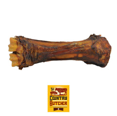 The Country Butcher beef shank bone ready for large dogs' long-lasting chew.