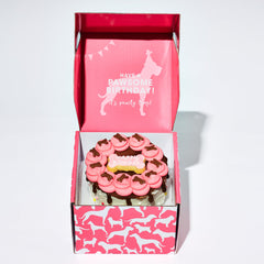 Thoughtfully Pets hand decorated pink dog cake showing princess design for photo moments.