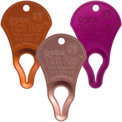The Tick Key Original Pack Multi-Color on a keychain for quick tick removal on hikes.