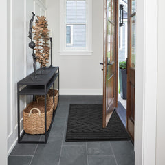 Tindbea low-profile 0.4-inch dog mat fits doors smoothly and stays in place.