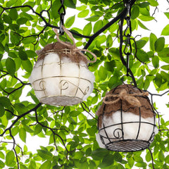 TOWDREU nesting ball hanging on branch in outdoor setting