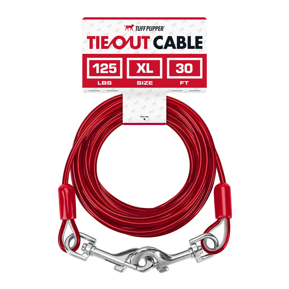 Tuff Pupper dog tie-out cable 30ft stretched between trees for safe yard exploration.