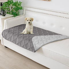 Tuffeel waterproof dog blanket flat on sofa protects against hair and spills.