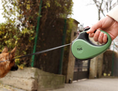 TUG 16ft tape retractable leash demonstrates extended reach and retractable design