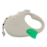TUG Oval 360-degree tangle-free retractable leash in cream for smooth daily walks.