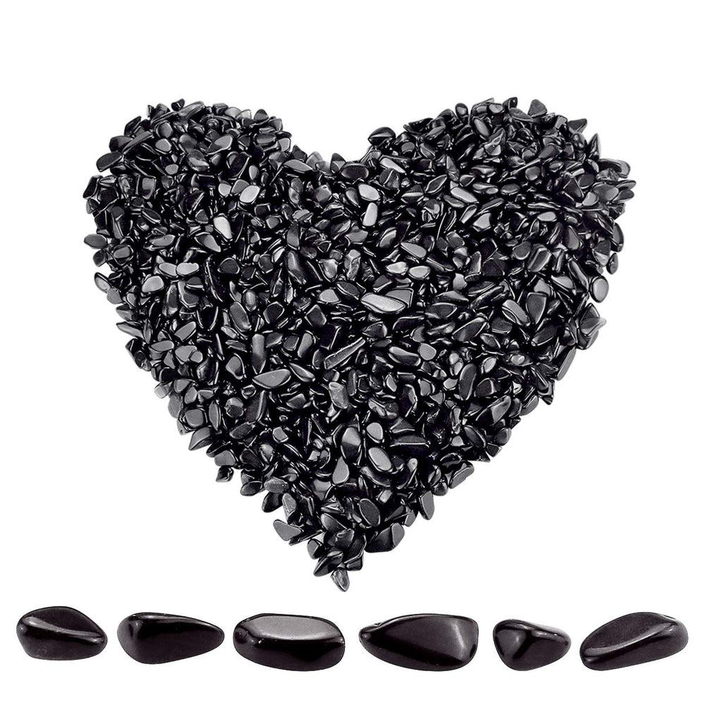Twdrer black obsidian chips closeup showing irregular shapes for decor and crafts.