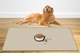 Ultibe 48x32 beige pet food mat with raised edge containing spills.