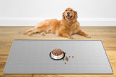 Ultibe largest pet food mat 48x32 setup with raised edges containing spills.