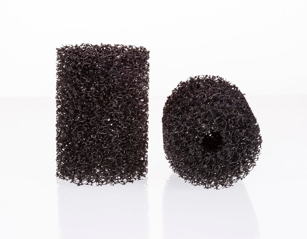UNEAK two-pack pre-filter sponge over aquarium intake for debris control.