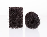 UNEAK two-pack pre-filter sponge over aquarium intake for debris control.
