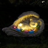 VKEVOC Cat Memorial Stone with solar angel wings in a garden setting for serene remembrance