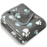 Vowanop premium soft dog blanket with paw pattern keeps pets warm on the sofa.