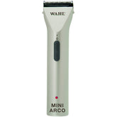 Wahl MiniArco trimmer in hand for precise pet grooming on faces