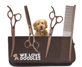 We Love Doodles straight scissor in hand for precise trimming on doodle coats.
