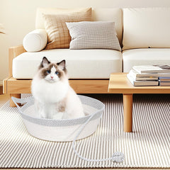 WEAVELYRICS cat bed basket close-up with toy tail for interactive play