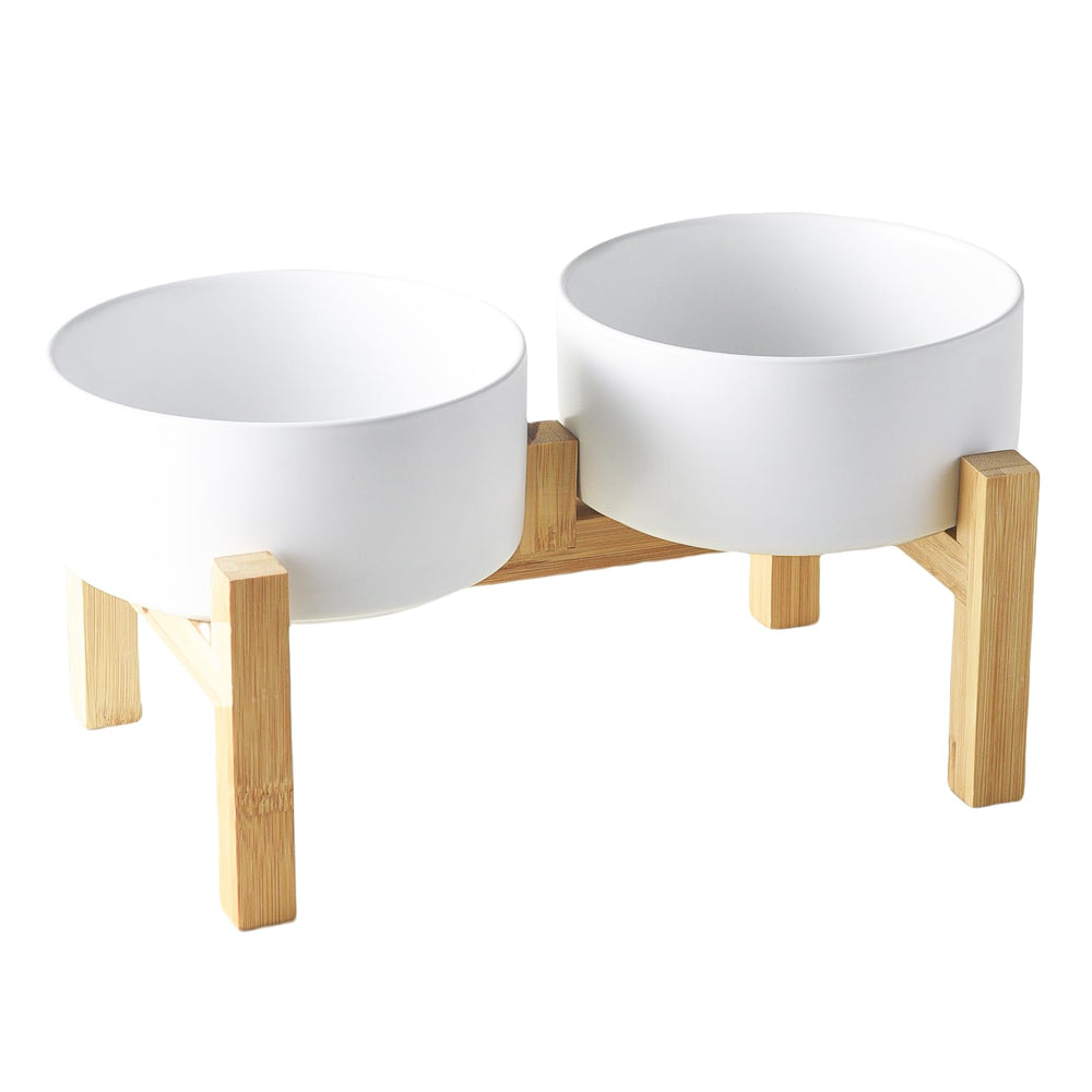 Welloyed raised ceramic dog bowl set on stand promotes comfortable eating posture for small and medium dogs.
