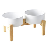 Welloyed raised ceramic dog bowl set on stand promotes comfortable eating posture for small and medium dogs.