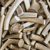 WhiteTail Naturals sun-aged deer antler chews, whole and split, for dogs' natural chewing.