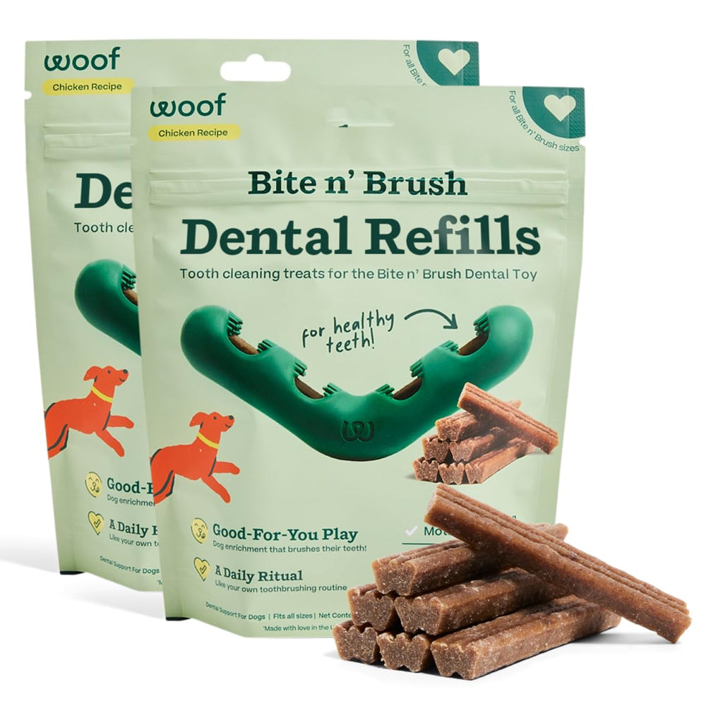 WOOF Bite n' Brush refills being inserted into the toy for self-brushing dental play.