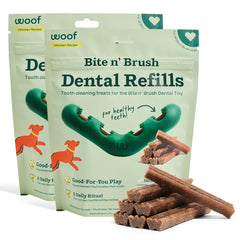 WOOF Bite n' Brush refills being inserted into the toy for self-brushing dental play.