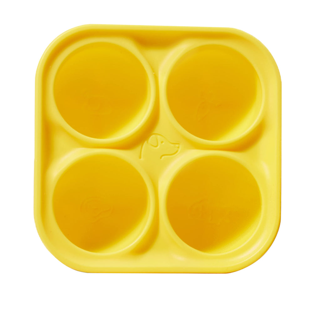 WOOF Pupsicle Treat Tray mold in use for easy, homemade frozen dog treats.