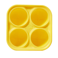 WOOF Pupsicle Treat Tray mold in use for easy, homemade frozen dog treats.