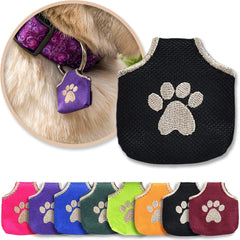 Woofhoof dog tag silencer with black pawprint cover quiets metal tags on a collar.