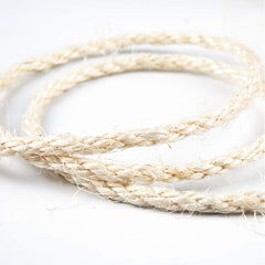 Yangbaga sisal rope wraps furniture legs, deters undesired scratching while protecting wood.