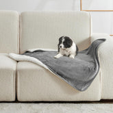 Yaning Waterproof Blanket on bed protects against spills and pet accidents.