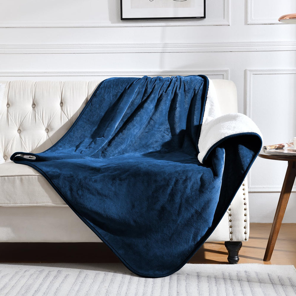Yaning waterproof blanket navy 50x60 on bed and couch provides spill protection.