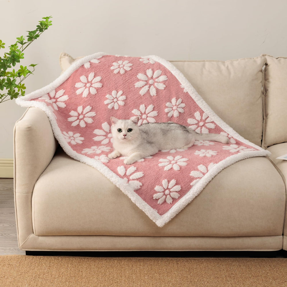 Yaning waterproof blanket pink texture closeup showing 3D floral pattern for pet comfort.